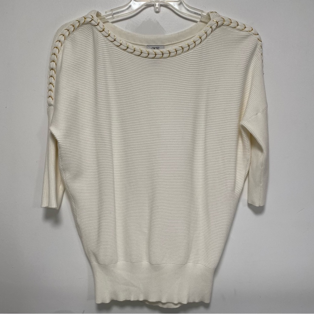 Cream sweater top with gold rings neckline